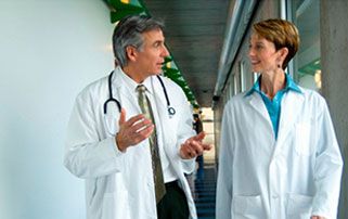 Two physicians walking in discussion
